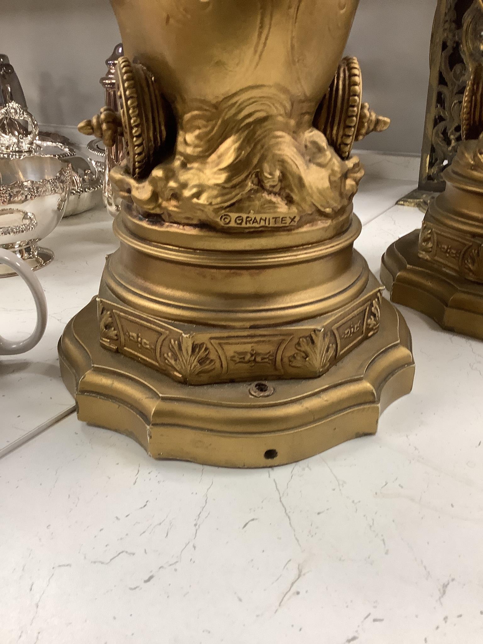 A pair of gilt spelter groups of a classical maiden and cherub, 61cm tall